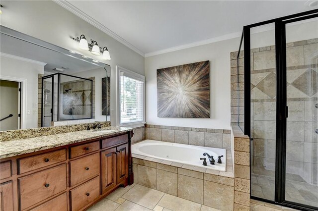 1054 Morgan Garner Dr SW, Lilburn, GA 30047 - full bathroom featuring a stall shower, crown molding, vanity, a garden tub, and tile patterned flooring