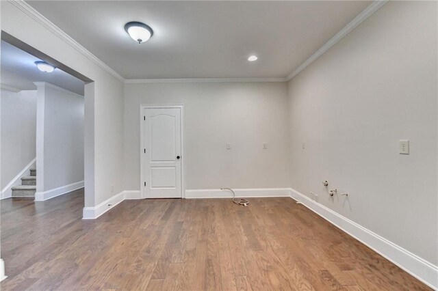 1054 Morgan Garner Dr SW, Lilburn, GA 30047 - unfurnished room with crown molding, wood finished floors, baseboards, stairway, and recessed lighting