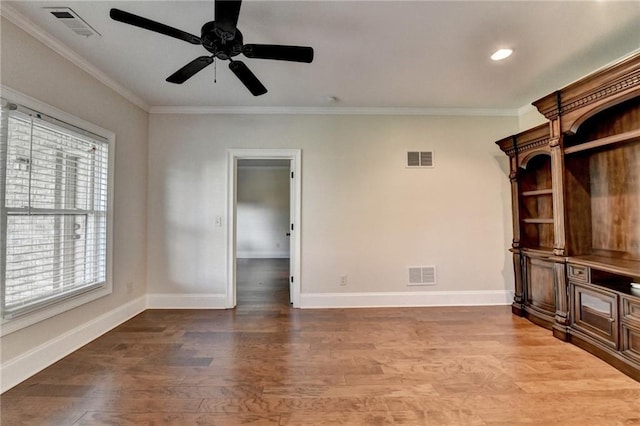 1054 Morgan Garner Dr SW, Lilburn, GA 30047 - unfurnished living room with crown molding, baseboards, light wood-style flooring, ceiling fan, and recessed lighting