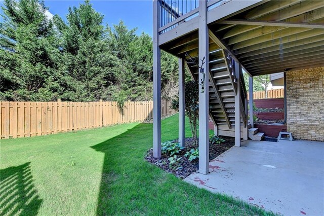 1054 Morgan Garner Dr SW, Lilburn, GA 30047 - view of yard featuring stairway, a patio, and a deck