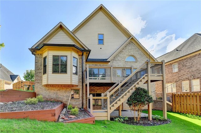 1054 Morgan Garner Dr SW, Lilburn, GA 30047 - back of house with brick siding, a deck, and stairway