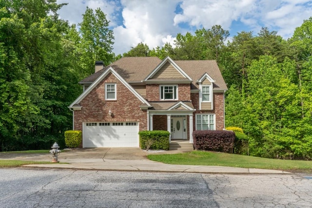 5746 Nix Bridge Rd, Gainesville, GA 30506 - view of front of home featuring concrete driveway, an attached garage, brick siding, and a chimney