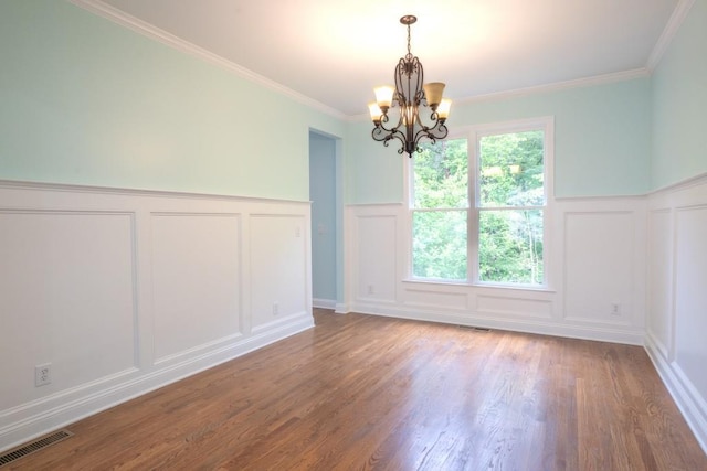 5746 Nix Bridge Rd, Gainesville, GA 30506 - unfurnished dining area featuring a decorative wall, a chandelier, wainscoting, wood finished floors, and ornamental molding