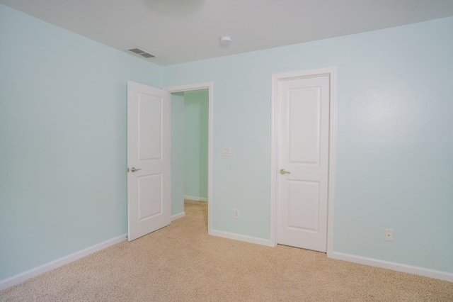 5746 Nix Bridge Rd, Gainesville, GA 30506 - unfurnished bedroom featuring light colored carpet and baseboards