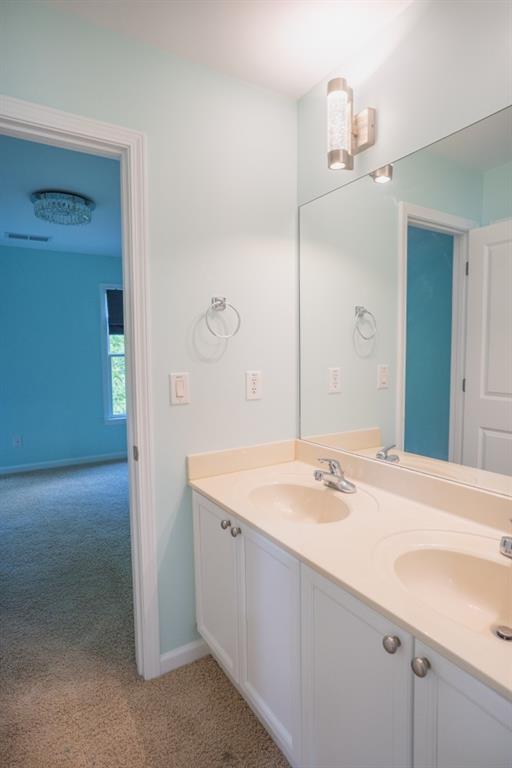 5746 Nix Bridge Rd, Gainesville, GA 30506 - bathroom with double vanity and baseboards