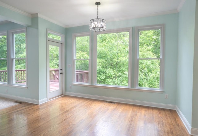 5746 Nix Bridge Rd, Gainesville, GA 30506 - unfurnished dining area with baseboards, plenty of natural light, wood finished floors, and crown molding