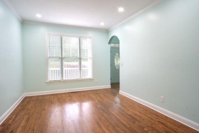 5746 Nix Bridge Rd, Gainesville, GA 30506 - unfurnished room featuring arched walkways, crown molding, baseboards, wood finished floors, and recessed lighting