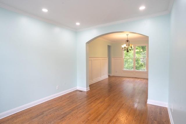 5746 Nix Bridge Rd, Gainesville, GA 30506 - spare room with a chandelier, wood finished floors, arched walkways, ornamental molding, and recessed lighting