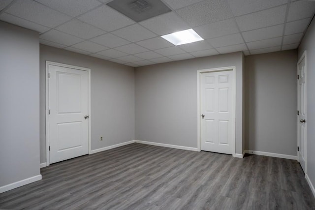 5746 Nix Bridge Rd, Gainesville, GA 30506 - basement featuring wood finished floors, a paneled ceiling, and baseboards