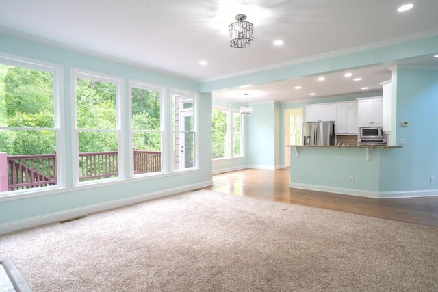 5746 Nix Bridge Rd, Gainesville, GA 30506 - unfurnished living room with ornamental molding, a chandelier, baseboards, carpet flooring, and recessed lighting