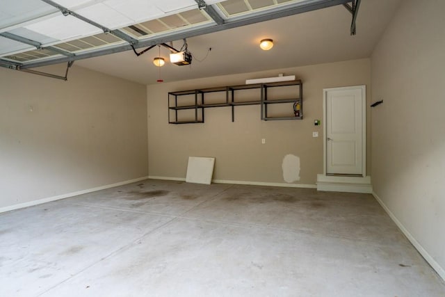 5746 Nix Bridge Rd, Gainesville, GA 30506 - garage featuring a garage door opener and baseboards