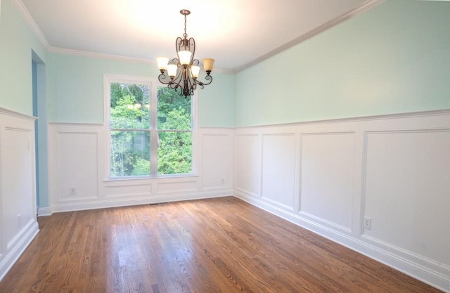 5746 Nix Bridge Rd, Gainesville, GA 30506 - unfurnished room with a decorative wall, a chandelier, wood finished floors, wainscoting, and crown molding