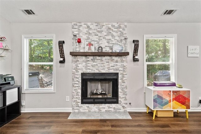 10650 Colony Glen Dr, Johns Creek, GA 30022 - living area with wood finished floors, a large fireplace, baseboards, and plenty of natural light