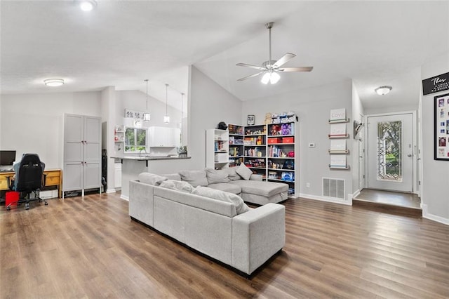 10650 Colony Glen Dr, Johns Creek, GA 30022 - living area with lofted ceiling, a desk, wood finished floors, a ceiling fan, and baseboards