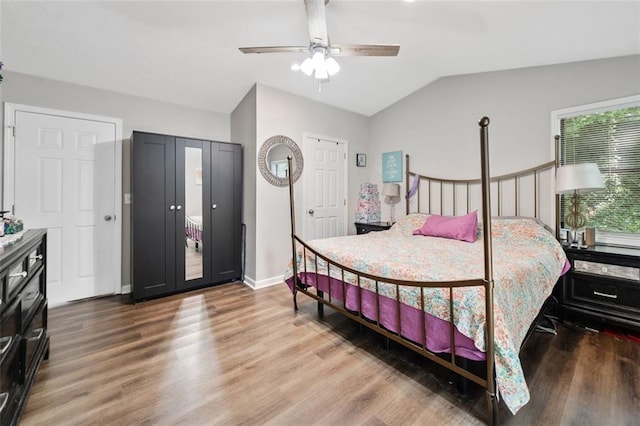 10650 Colony Glen Dr, Johns Creek, GA 30022 - bedroom with wood finished floors, lofted ceiling, baseboards, and a ceiling fan
