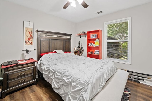 10650 Colony Glen Dr, Johns Creek, GA 30022 - bedroom with dark wood-style flooring and a ceiling fan