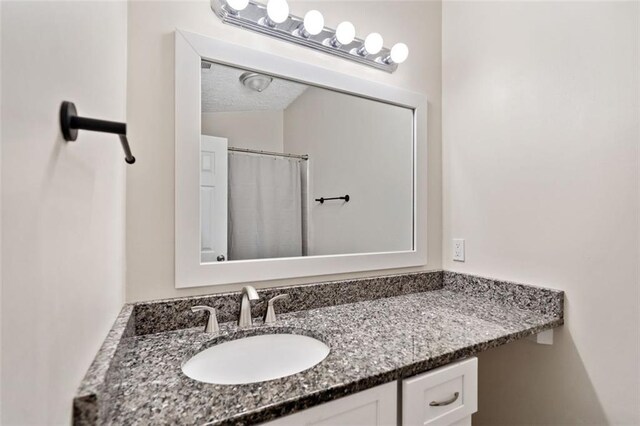 10650 Colony Glen Dr, Johns Creek, GA 30022 - bathroom featuring vanity and curtained shower