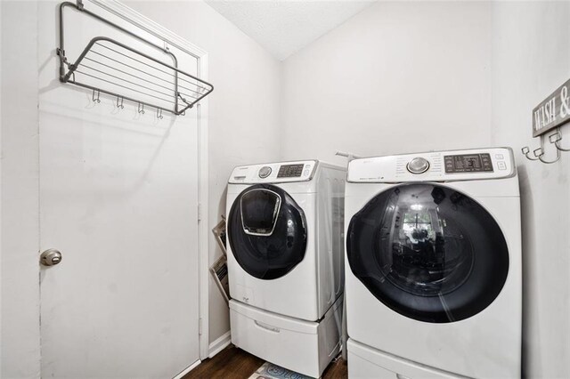10650 Colony Glen Dr, Johns Creek, GA 30022 - laundry room with washer and clothes dryer and dark wood-style flooring