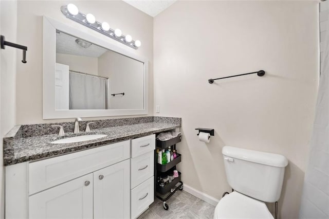 10650 Colony Glen Dr, Johns Creek, GA 30022 - bathroom featuring toilet, baseboards, and vanity