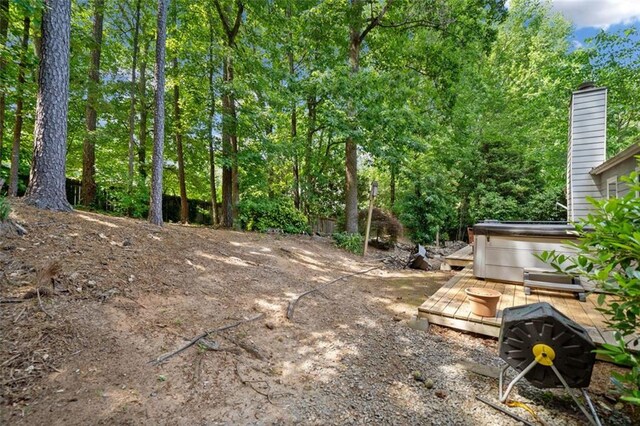 10650 Colony Glen Dr, Johns Creek, GA 30022 - view of yard with a hot tub and a wooden deck