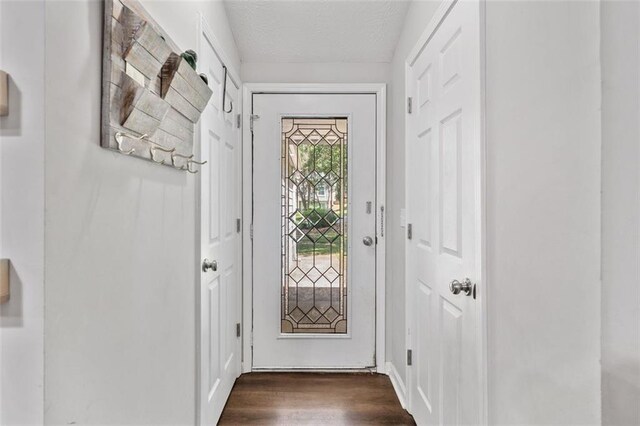 10650 Colony Glen Dr, Johns Creek, GA 30022 - entryway with dark wood-type flooring and a textured ceiling