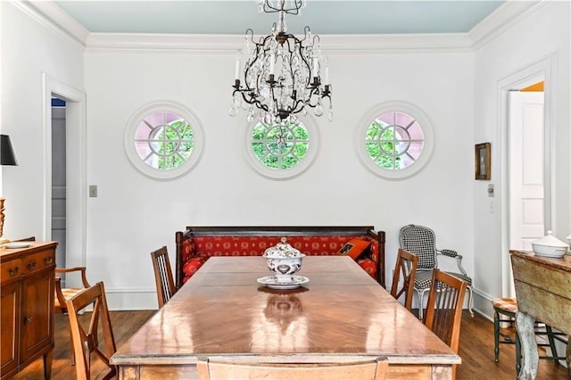 dining area featuring a notable chandelier, crown molding, baseboards, and dark wood-style flooring