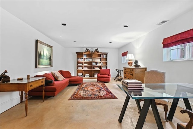 living room with visible vents, recessed lighting, and finished concrete flooring