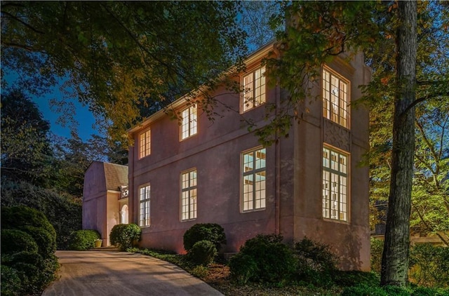 view of property exterior with stucco siding