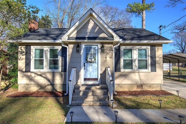 bungalow-style home featuring a shingled roof, crawl space, driveway, and a chimney