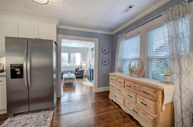 kitchen featuring an ornate ceiling, dark wood finished floors, visible vents, white cabinets, and stainless steel fridge with ice dispenser