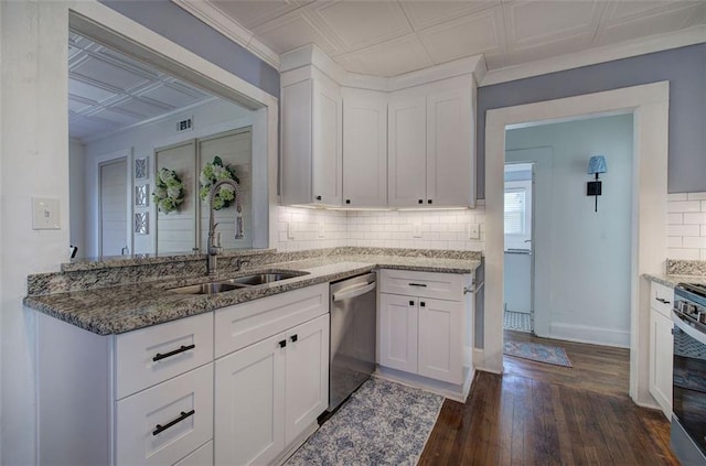 kitchen with appliances with stainless steel finishes, stone countertops, an ornate ceiling, and a sink