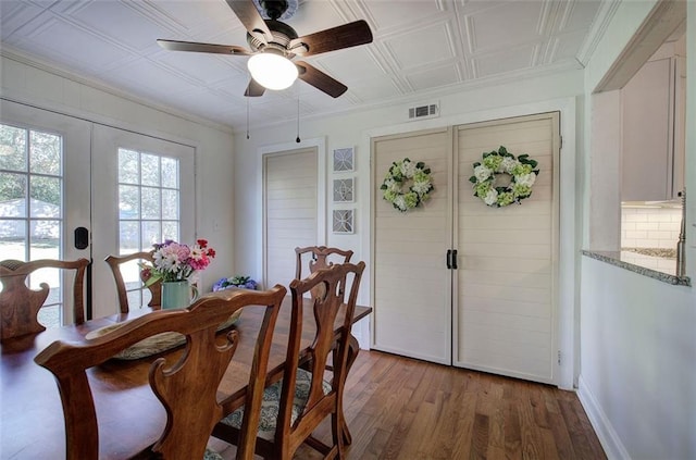 dining room featuring visible vents, a ceiling fan, an ornate ceiling, french doors, and light wood-type flooring