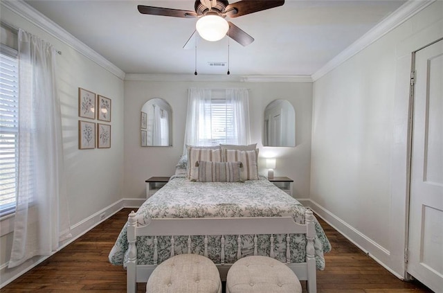 bedroom featuring ceiling fan, dark wood-type flooring, visible vents, baseboards, and ornamental molding