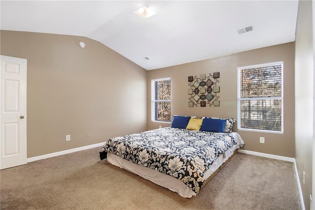 bedroom featuring baseboards, visible vents, vaulted ceiling, and carpet flooring