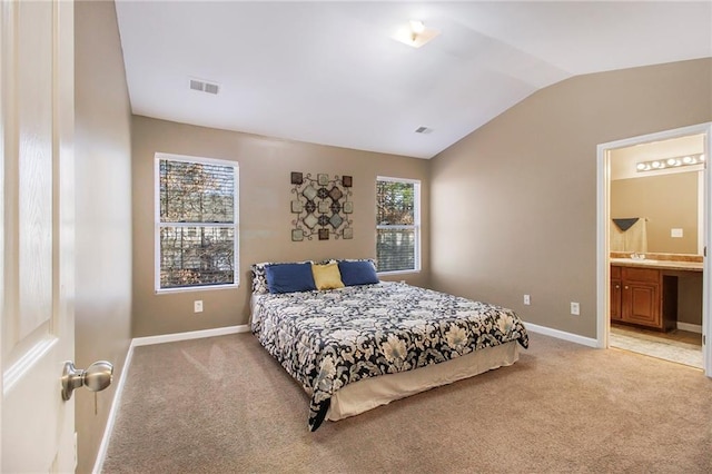 bedroom featuring light carpet, baseboards, visible vents, and vaulted ceiling