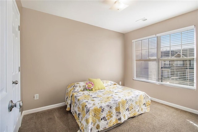 bedroom featuring multiple windows, carpet, visible vents, and baseboards