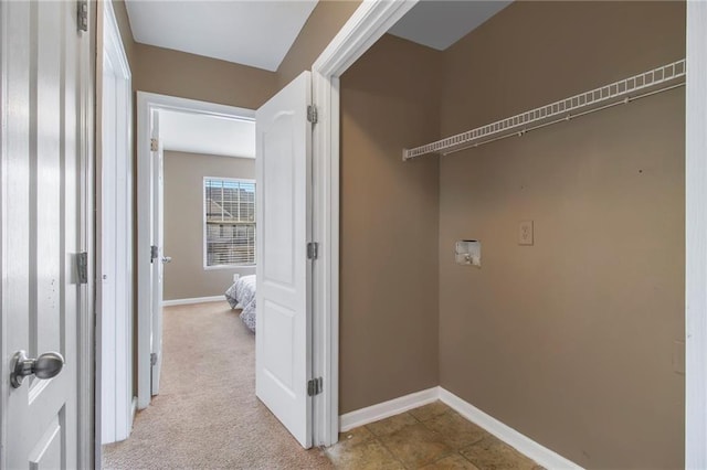 clothes washing area with laundry area, washer hookup, carpet, and baseboards