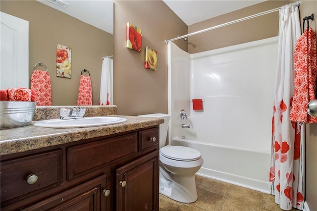 bathroom with tile patterned flooring, shower / tub combo with curtain, vanity, and toilet