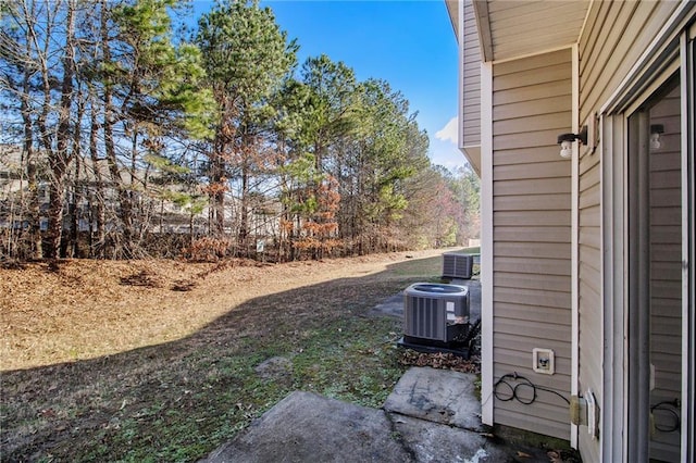 view of yard with central AC unit