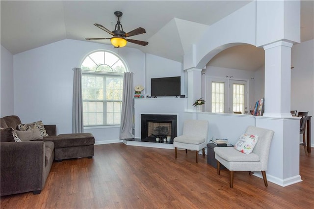 sitting room featuring hardwood / wood-style flooring, ceiling fan, ornate columns, and lofted ceiling