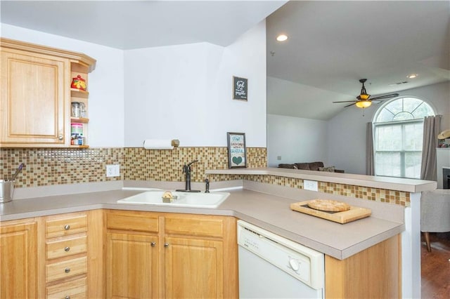 kitchen with wood-type flooring, dishwasher, kitchen peninsula, sink, and light brown cabinets