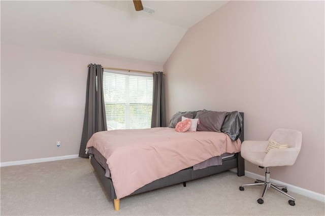 bedroom featuring lofted ceiling, light carpet, and ceiling fan