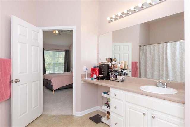 bathroom featuring curtained shower and vanity