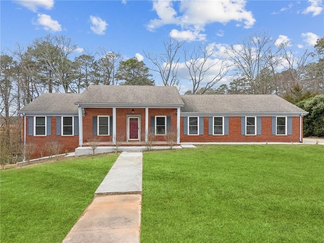 ranch-style home with a porch and a front lawn