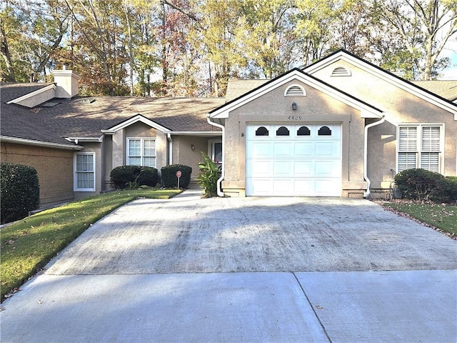 single story home featuring a garage