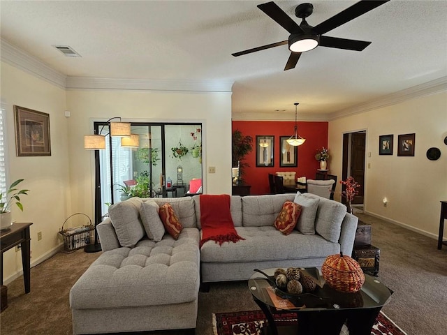 carpeted living room with ceiling fan and crown molding