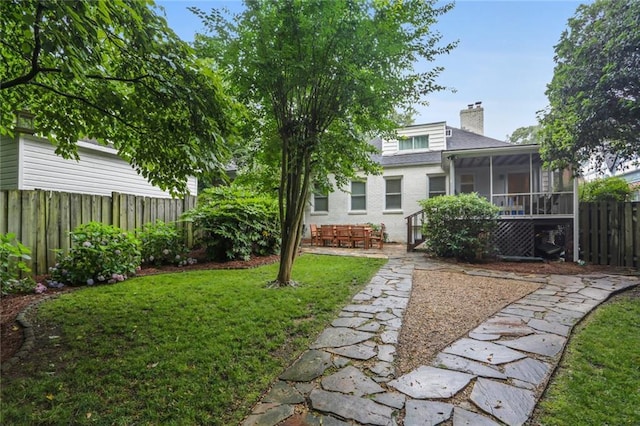 view of yard with a sunroom