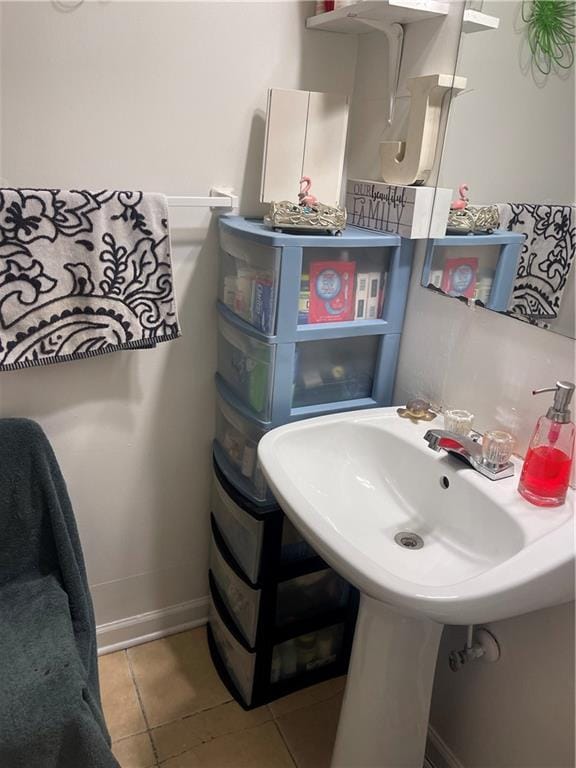 bathroom with tile patterned floors