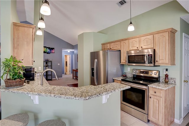 kitchen with stainless steel appliances, lofted ceiling, visible vents, light brown cabinets, and a peninsula