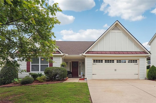 203 Logan Creek Ln, Dallas, GA 30132 - view of front of property featuring board and batten siding, concrete driveway, a garage, and a front yard